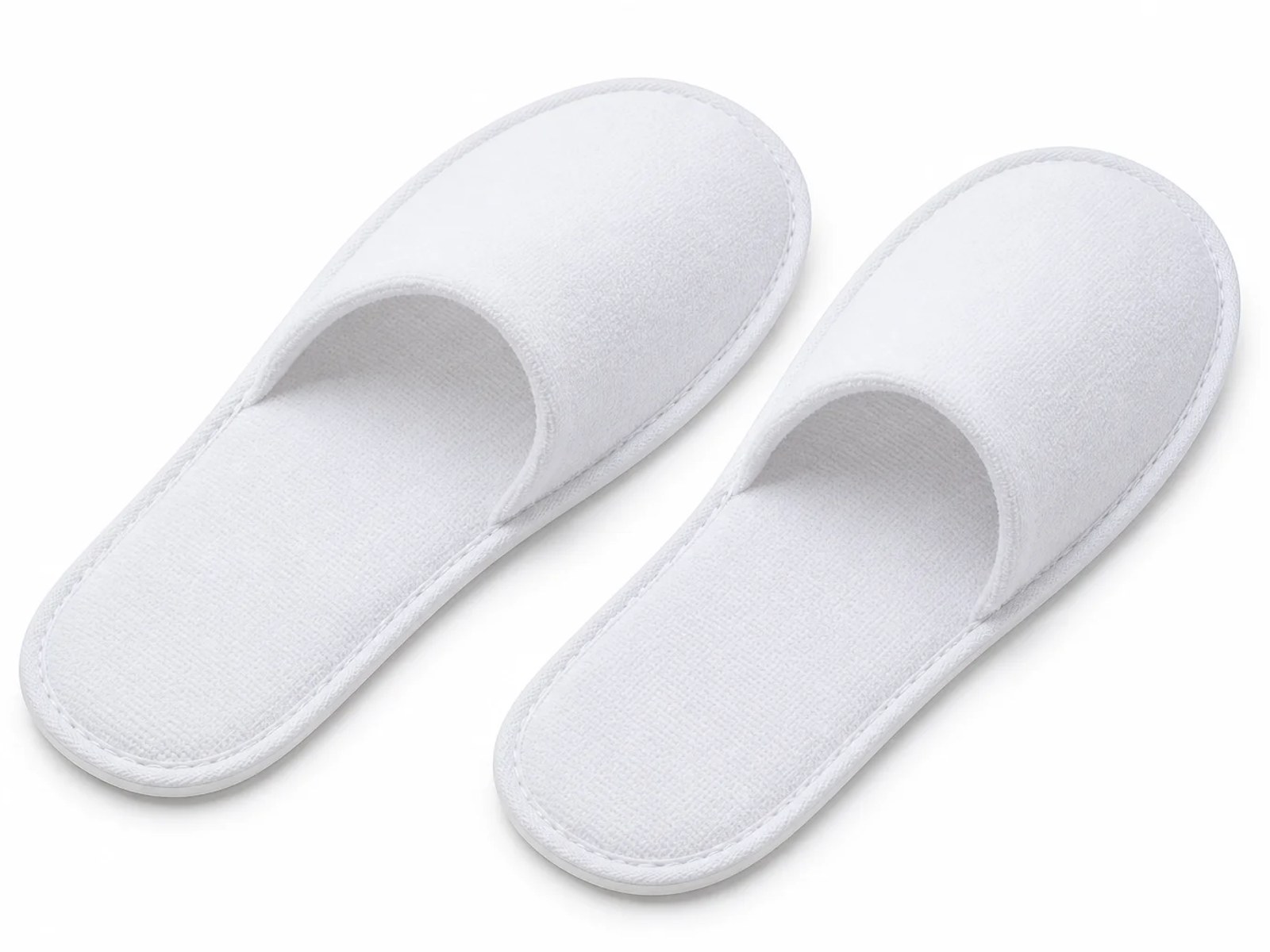 Closed-toe terry slippers for hotel guest rooms